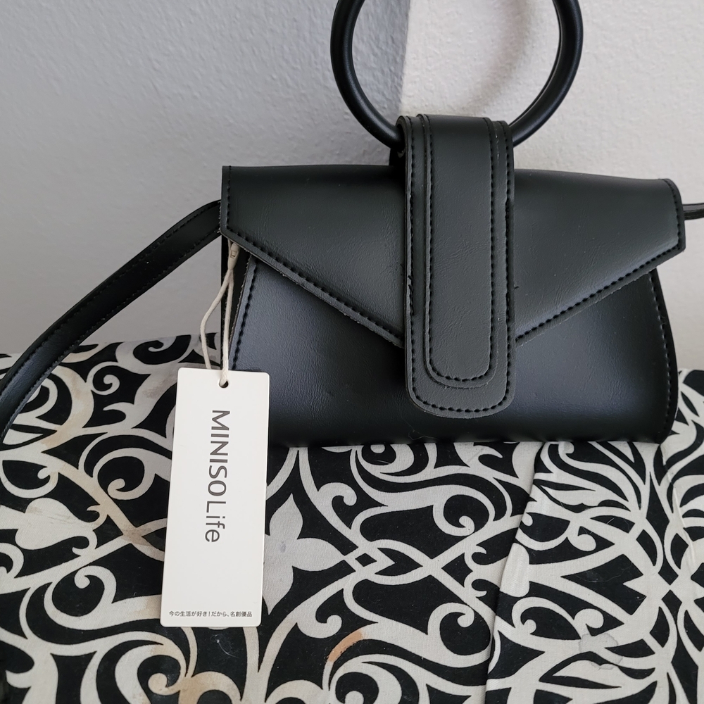 Sleek Black Mini Bag with Geometric Design and Loop Handle